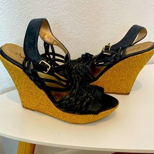 Women’s black Qupid strap wedge heels. Open toed.
